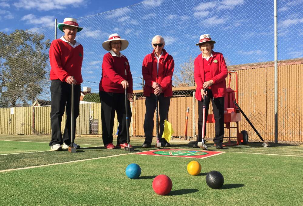 Celebration: Muller Park Tennis and Croquet Club members Peter Heywood, Jenny Brown, Ben Vang and president Tricia Shanks, have their mallets at the ready for their first hit on the new croquet court. Photo: FAYE WHEELER
