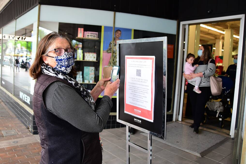 Sue Egan checks into Myer on its first day of reopening. Photo: BELINDA SOOLE