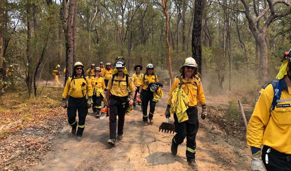 Volunteer firefighters battling long-running blazes in NSW. Photo: NSW Rural Fire Service/ Facebook