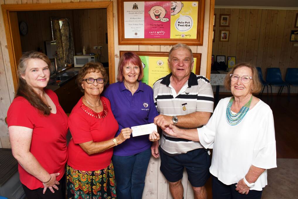 Gift: Camp Quality representative Anne Bassett (centre) accepts an $11,000 donation on behalf of the charity from Muller Park Tennis Club members Anne Barwick, Margaret Rootes, Ken Bailey and Jenny Brown. Photo: BELINDA SOOLE