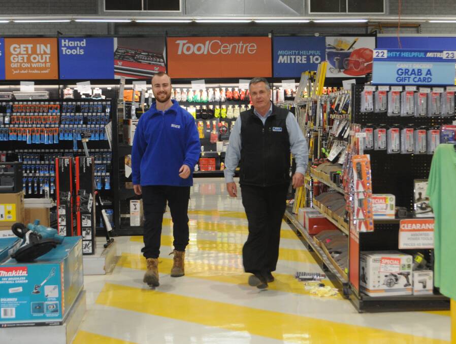 Step up: Petrie's Mitre 10 store manager Brad Petrie with Michael Brennan, managing director of Brennan's Mitre 10 on the eve of the ownership change. Photo: FAYE WHEELER