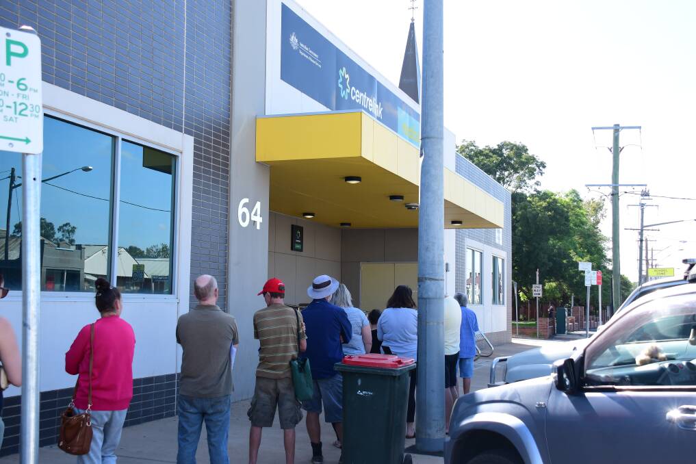 A line of people outside Dubbo's Centrelink office in March, as the COVID-19 pandemic and its impacts came to the fore in Australia. 