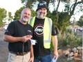 Dubbo Westview Drive-In operator Jason Yelverton, pictured with Wayne Amor at the final drive-in event, hopes to be able to save the screen and other equipment. Picture: AMY MCINTYRE