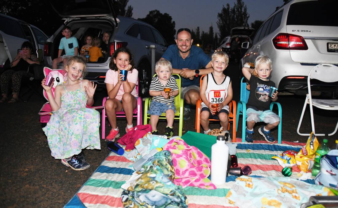 Fun: Lily Orford, Lainey Simcox with Oliver, Ben, Toby and Harry Orford at Friday night's sell-out movie event at the drive-in. Picture: AMY MCINTYRE