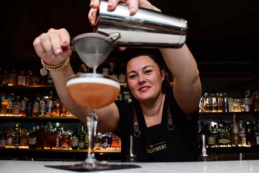 Mix it up: The Establishment Bar Dubbo owner Tenelle Bond pours a French martini. Photo: BELINDA SOOLE