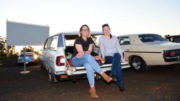Iconic experience: Bec Taylor and Kim Howard in October 2020 at the 50th anniversary of the drive-in's opening. The Dubbo Westview Drive-In is showing a range of movies in its final weeks. Picture: AMY MCINTYRE