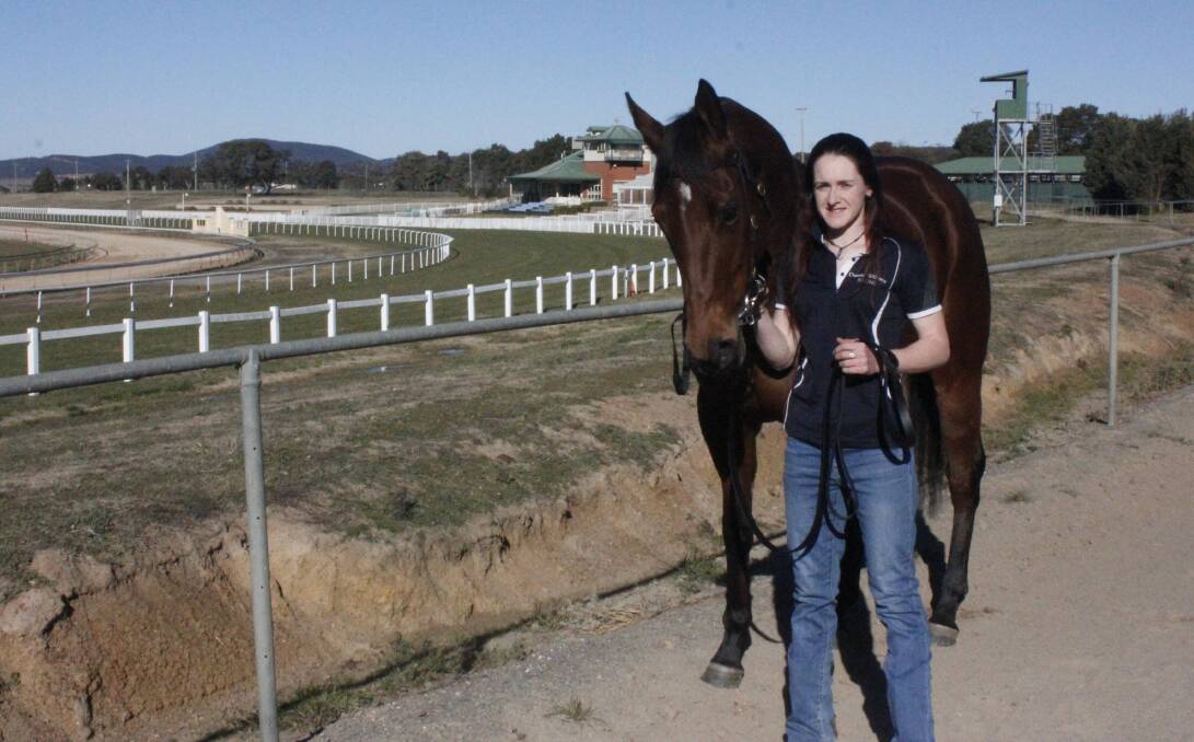 Big Moment: First-time winner Angela Cooper alongside 'Tootz', one of the horses at the Goulburn Race Track. Photo: Burney Wong.