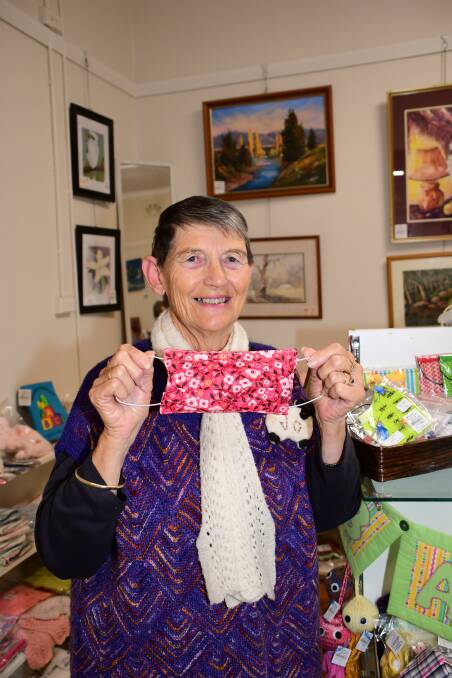 SAFE WEAR: Dubbo Arts and Craft's Jo thomas with one of the face-masks created by a member. PHOTO: AMY MCINTYRE.