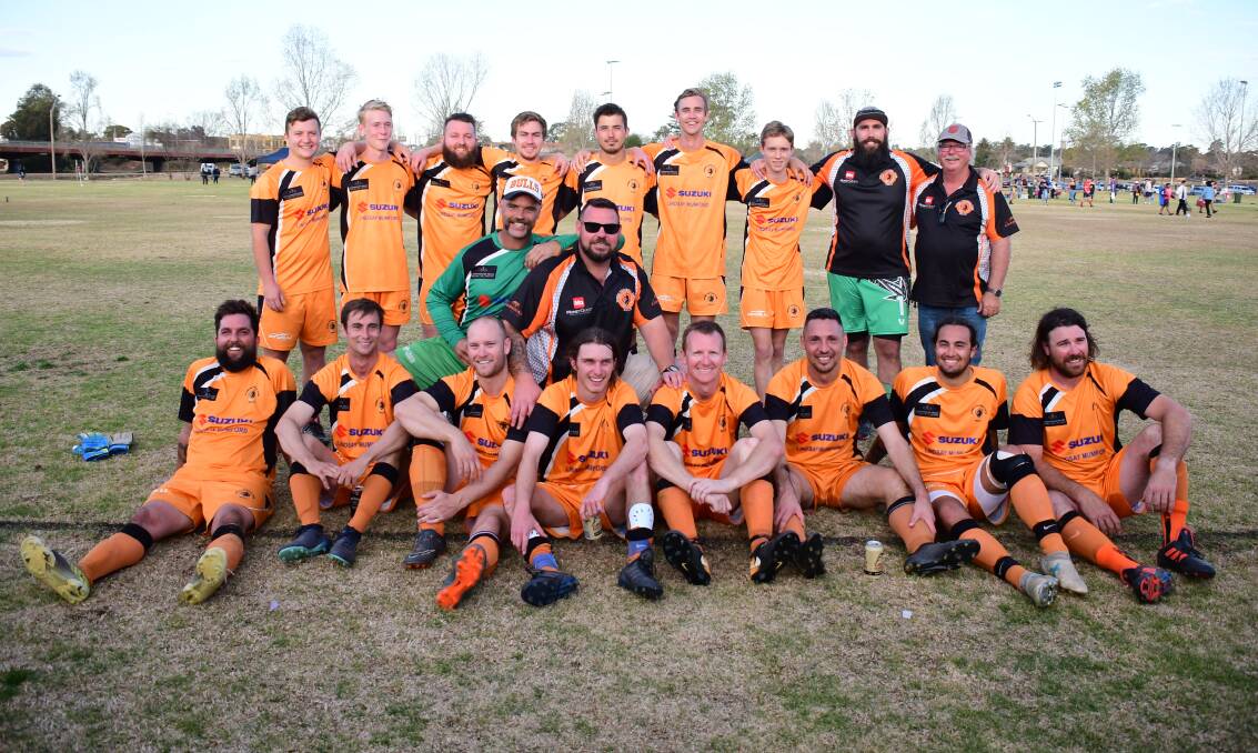 Winners: The victorious Bulls FC, pictured on the field after their grand final win. Photo: Belinda Soole. 