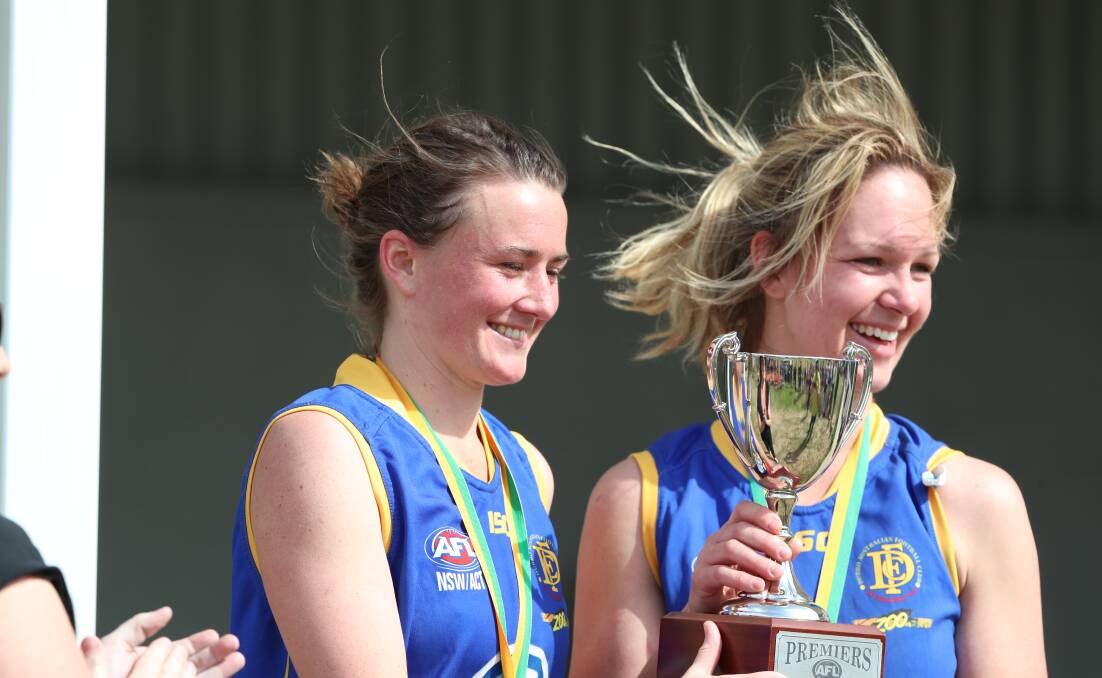 RETURN IN THE CARDS: Captain Emily Warner holds up the premiership trophy her side won in 2018 before being forced to fold. PHOTO: PHIL BLATCH.