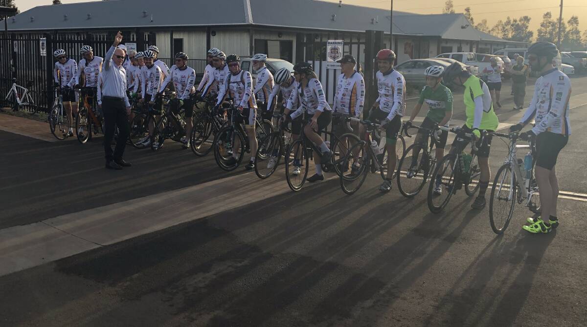 We're off: The riders and support crew setting off from Macquarie Home Stay at 7am on Monday morning. PHOTO: SUPPLIED.