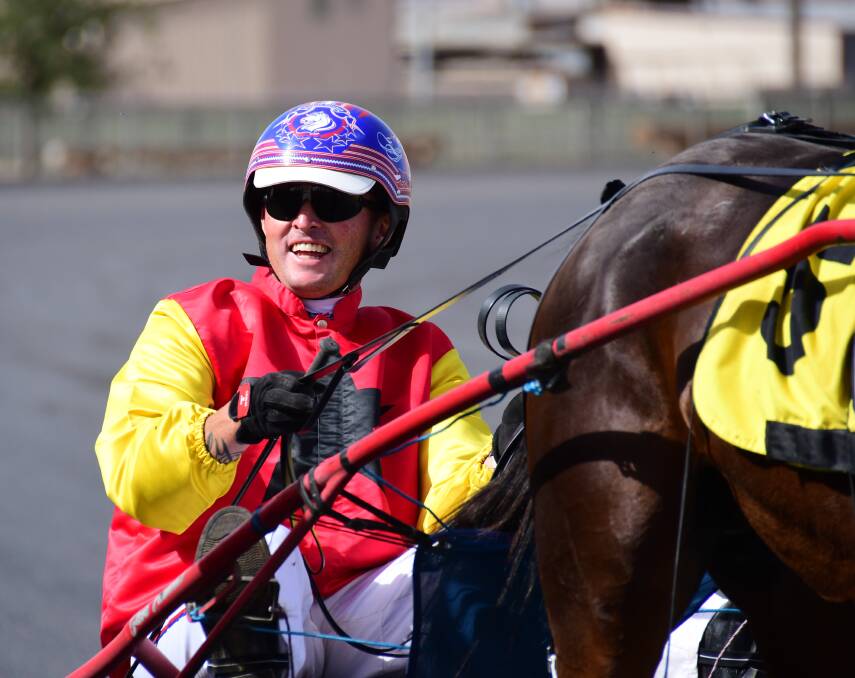Ecstatic: Nathan Turnbull couldn't hold back the grin after opening up with a gutsy win in the first race of the day. Photo: Amy McIntyre.