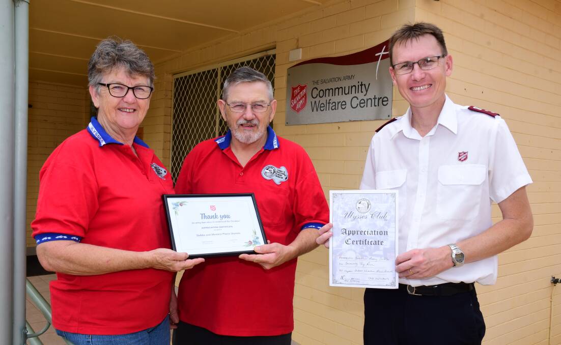 GIVING BACK: Margaret and Dave Readford, alongside David Sutcliffe from the Salvation Army. PHOTO: BELINDA SOOLE. 
