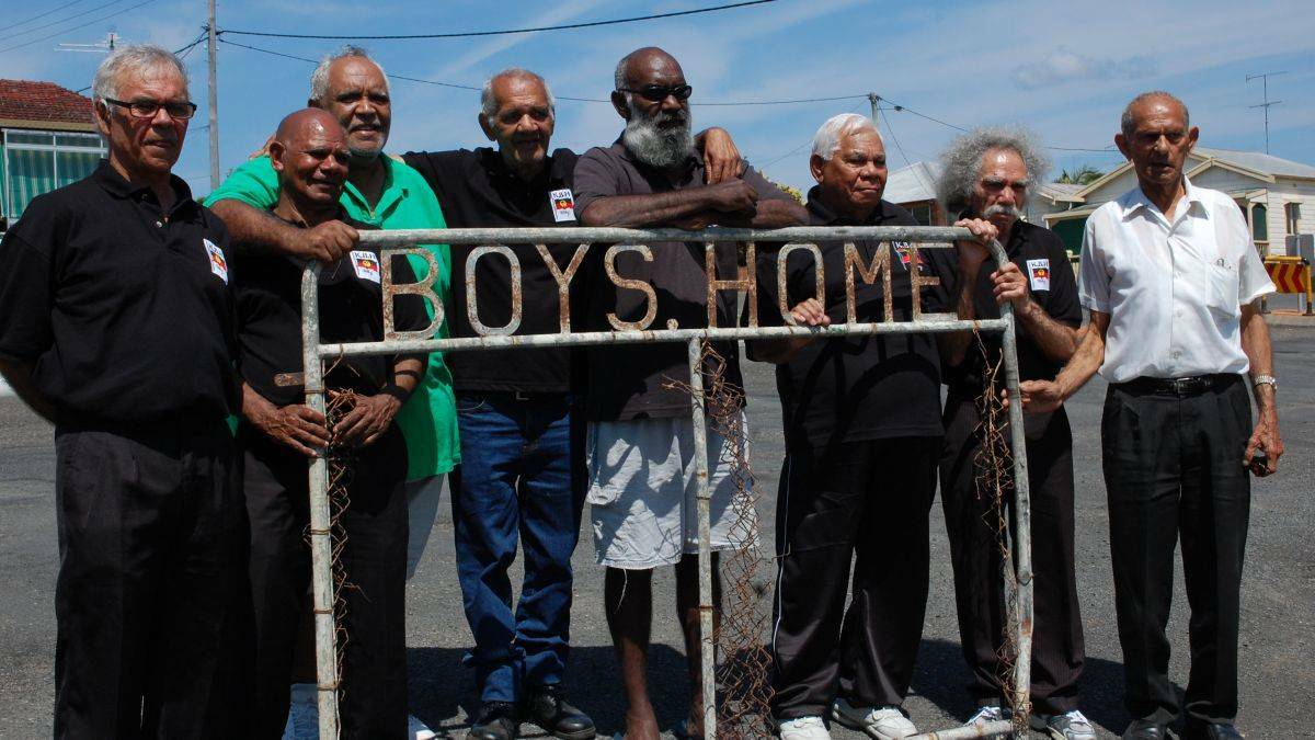 In 2012, Aboriginal Elders with part of the gate from the Kinchela Boys Home that was sent to the National Museum. Photo: File