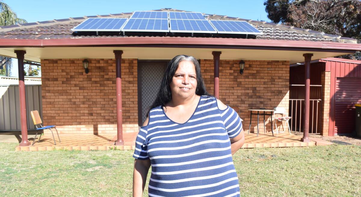 Sandra Riley, who has saved almost $300 on her energy bills since getting the solar panels three months ago. Photo: JENNIFER HOAR