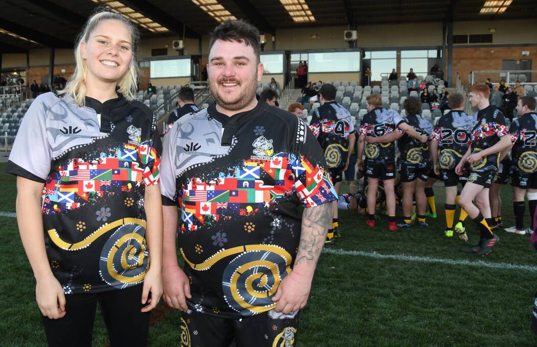 HAPPY TO HELP: Krystal Dallinger and Rhinos
captain James Dodd. Photo: AMY MCINTYRE