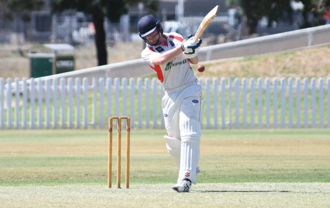 NO PRESSURE: Tom Atlee slogs the ball for RSL Colts against CYMS last weekend. Photo: BELINDA SOOLE