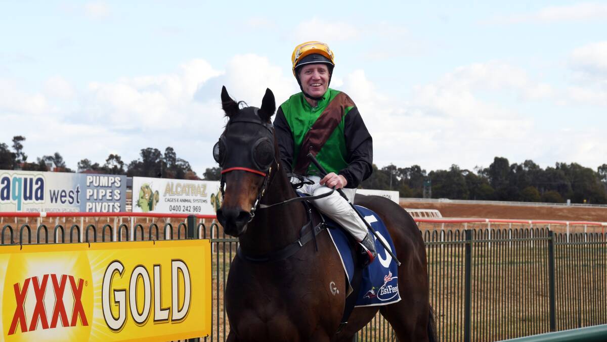 WINNING FORM CONTINUES: Dubbo jockey Ken Dunbar (pictured after a recent win at Dubbo Turf Club) secured a four-win haul at Grenfell on Saturday. Photo: NICK GUTHRIE