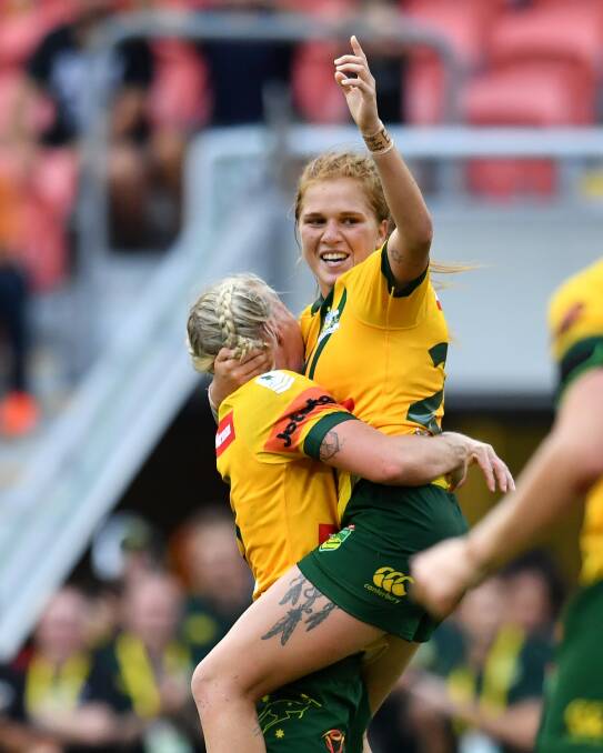 CHAMPION: Caitlin Moran celebrates kicking the winning field goal for the Australian Jillaroos in last year's World Cup final win over New Zealand. She's coaching the Newcastle Yowies this weekend. Photo: AAP Image/ Darren England