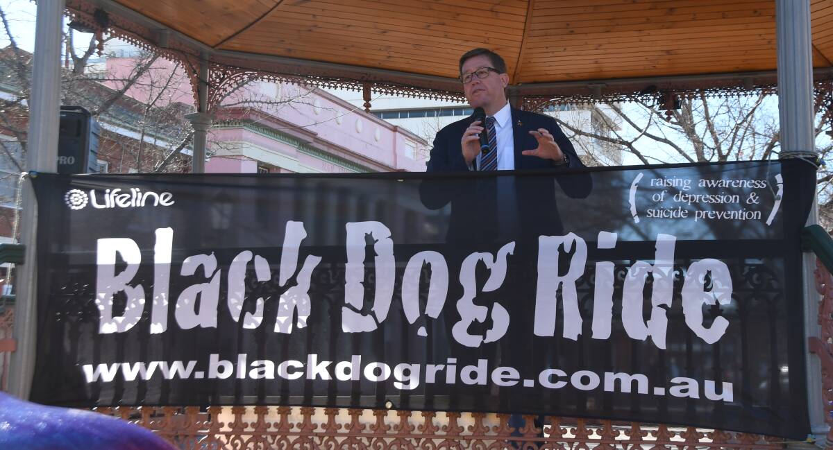 Dubbo MP Troy Grant addresses about 100 riders and community members at the Church Street rotunda on Friday. Photo: JENNIFER HOAR