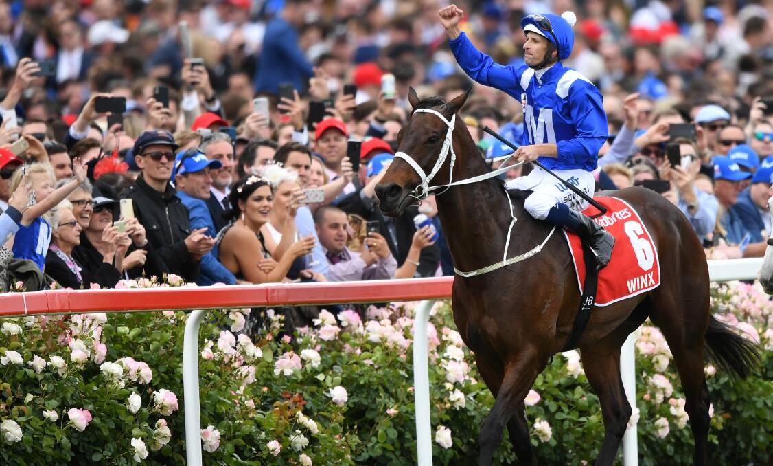 ELATED: Jockey Hugh Bowman and Winx pictured after winning the Cox Plate in October. Photo: AAP Image/Julian Smith