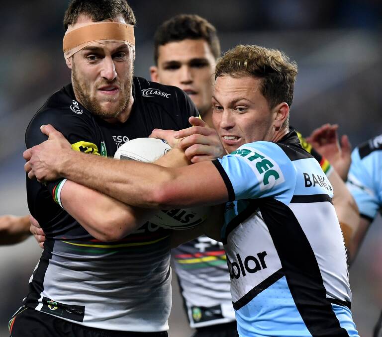 AIMING HIGHER: Isaah Yeo gets tackled by former teammate Matt Moylan in the Panthers' 2018 semi final loss. The Panthers finished fifth this season, and hope to go better in 2019. Photo: AAP IMAGE/DAN HIMBRECHTS