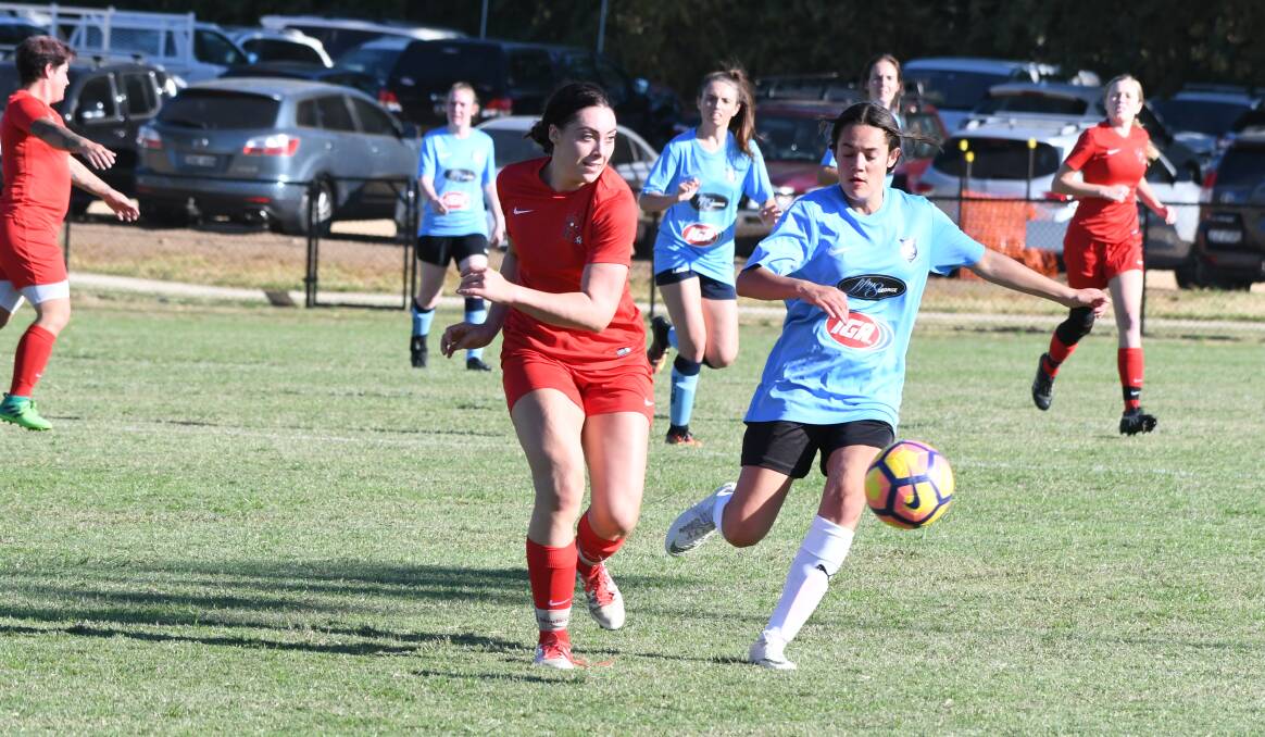 FEARLESS: Dubbo's Claire Sienkiewicz takes on her Bathurst opponent in Saturday evening's Inter-town Challenge. Photo: CHRIS SEABROOK