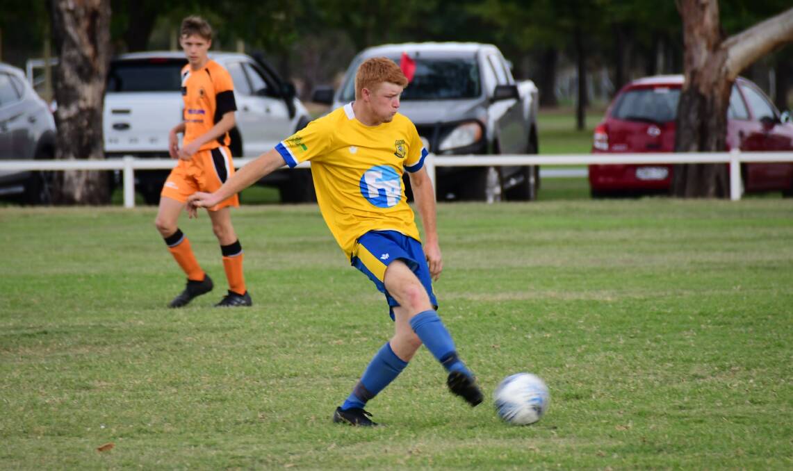 Connor McDonald clears the ball in the South Dubbo Wanderers' round two loss to Dubbo FC. Photo: AMY MCINTYRE