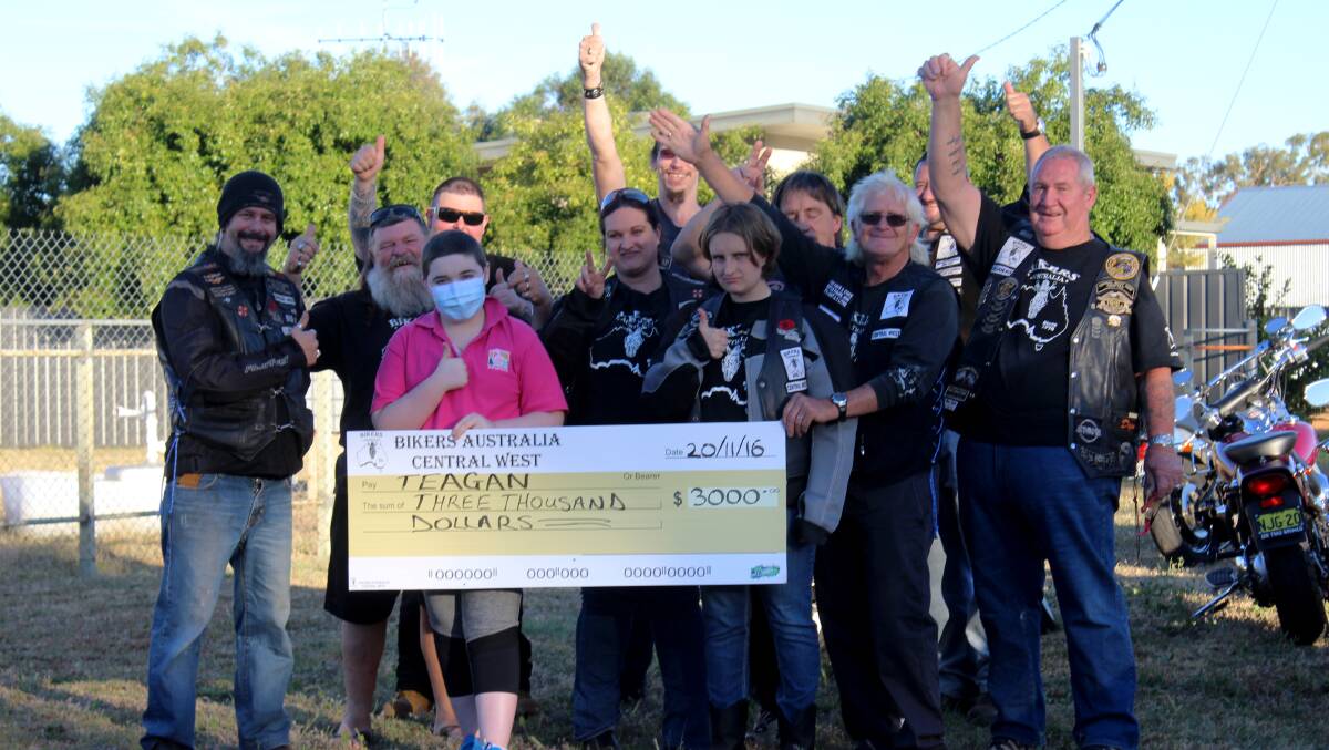 Teagan Ferguson accepts the donation from Bikers Australia Central West. Photo: REBECCA DOUGLAS