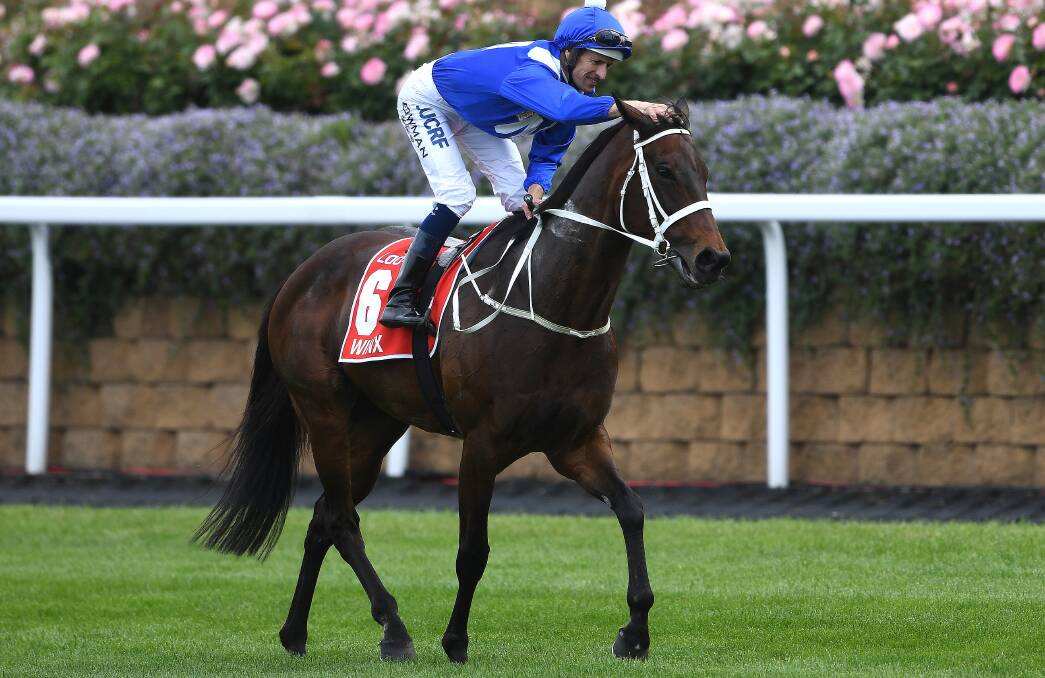 SHE'S APPLES: Dunedoo's Hugh Bowman with Winx after winning Saturday's Cox Plate at Moonee Valley Racecourse. Photo: AAP Image/Julian Smith