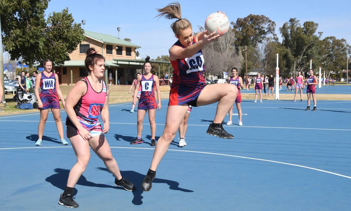 CLASH OF THE TITANS: Fusion Heat managed a narrow 38-34 win over St Collegians at the Nita McGrath courts on Saturday. Photos: AMY MCINTYRE