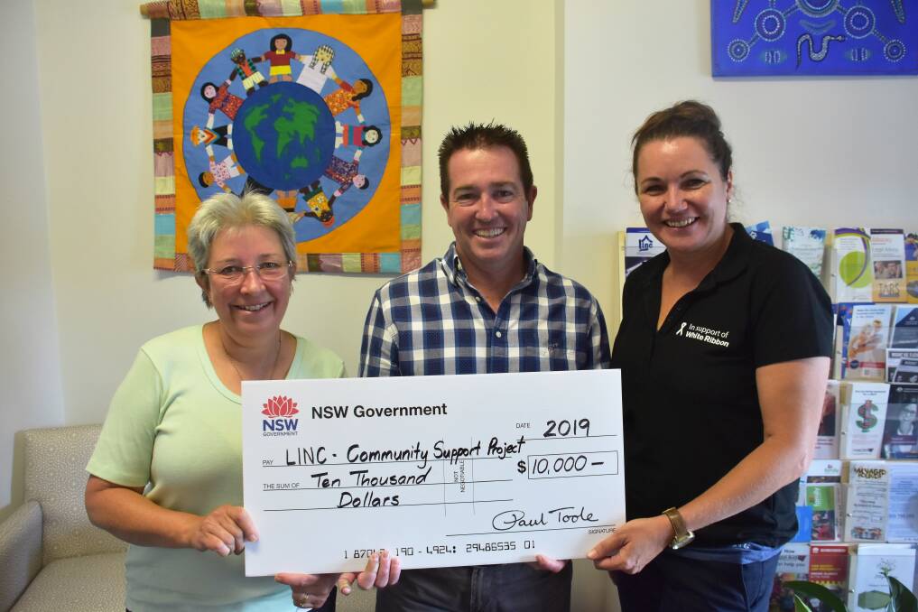 Member for Bathurst, Paul Toole, (centre) awarding the Lithgow Information and Neighbourhood Centre a grant of $10,000 for their Multicultural Community Support project last year. Image: Alanna Tomazin.