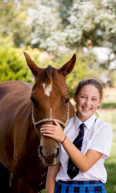 Bring a friend: Scots All Saints students enjoy the school's equestrian program and the opportunity to have their own horse nearby. Picture: Supplied