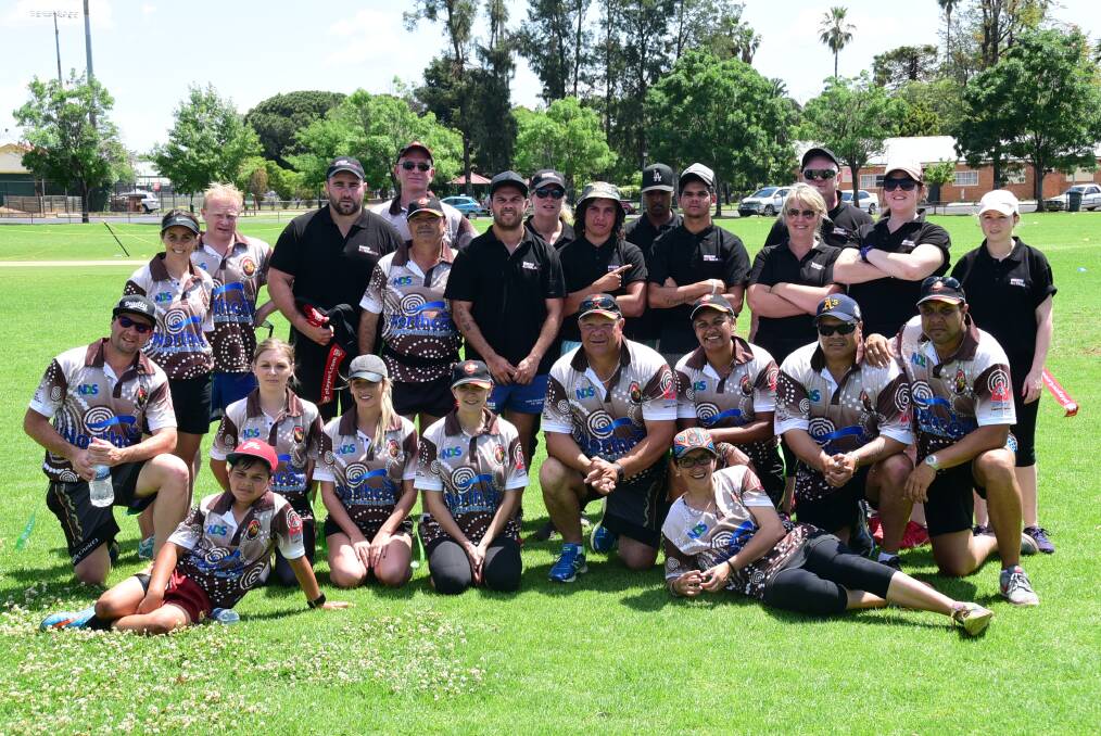 Players from Dubbo Disability Information Group (DIG) and Mission Australia come together for a photo at yesterday's League Tag Knockout at No.2 Oval. 												         Photo: BROOK KELLEHEAR-SMITH