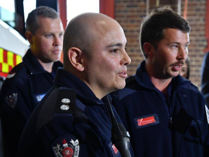 Firefighter Gonzalo Herrara (C) and colleagues took on the alleged murderer in Sydney's CBD.