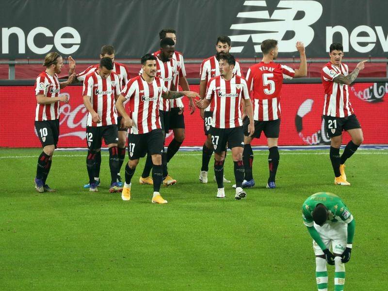 Athletic players celebrate moving into the top half of the La Liga table by beating Real Betis.