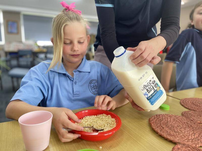 Student Ruby enjoys a breakfast club meal at Buninyong Public School in Dubbo. (SUPPLIED)
