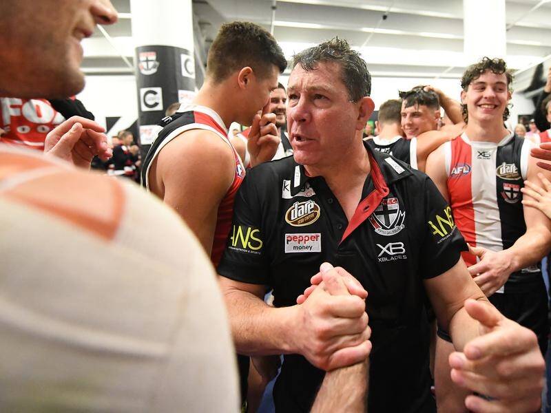 Saints coach Brett Ratten (third from left) celebrates his side's win over the Western Bulldogs.