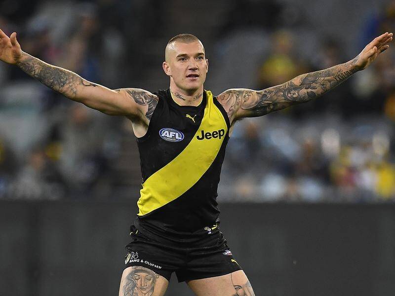 Tigers star Dustin Martin has avoided suspension over contact with a referee in Sunday's AFL win.