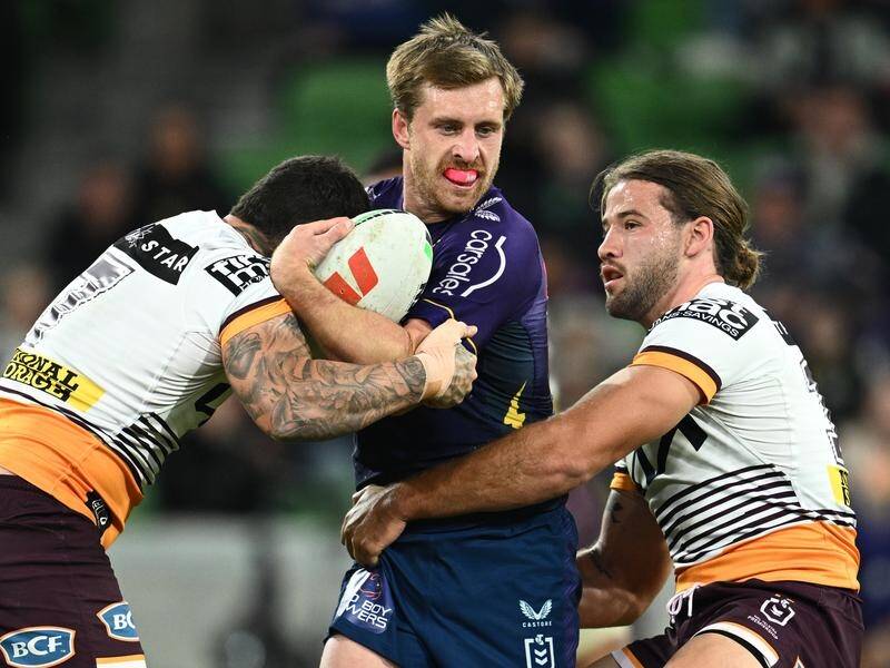 Melbourne beat Brisbane to sign Cameron Munster (C) in 2013 and he's glad they did. (Joel Carrett/AAP PHOTOS)