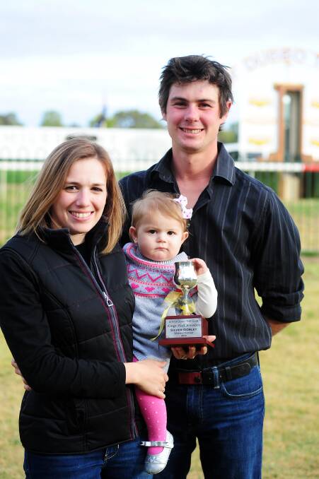 Trainer Clint Lundholm with his wife Ashleigh, daughter Allie and the Kings Hall Jewellers Silver Goblet.