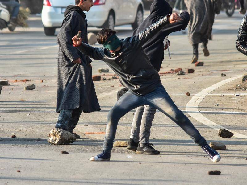 Government forces fired tear gas at stone-throwing Kashmiri protesters.