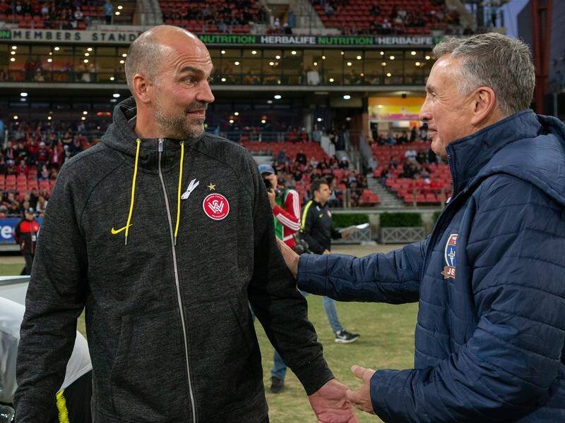 Markus Babbel (left) received sympathy from Jets coach Ernie Merrick after Friday's A-League defeat.