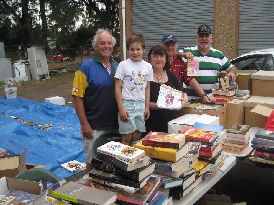 Dubbo Macquarie Rotary Club members Peter Stanford, grandson Alexander Croft, Lorraine and Peter Croft with Steve Cowley at the book fair working bee. 
	Photo: CONTRIBUTED