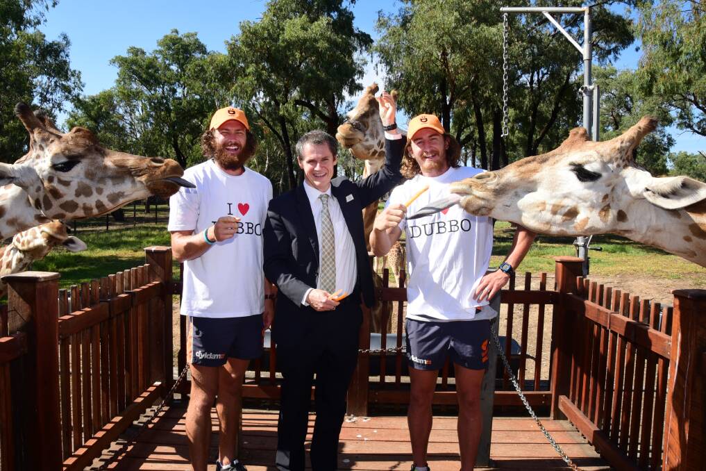 Greater Western Sydney Giants Sam Reid (left) and Dylan Addison with mayor Mathew Dickerson at Westerns Plains Zoo on Tuesday. 				 Photo: Belinda Soole
