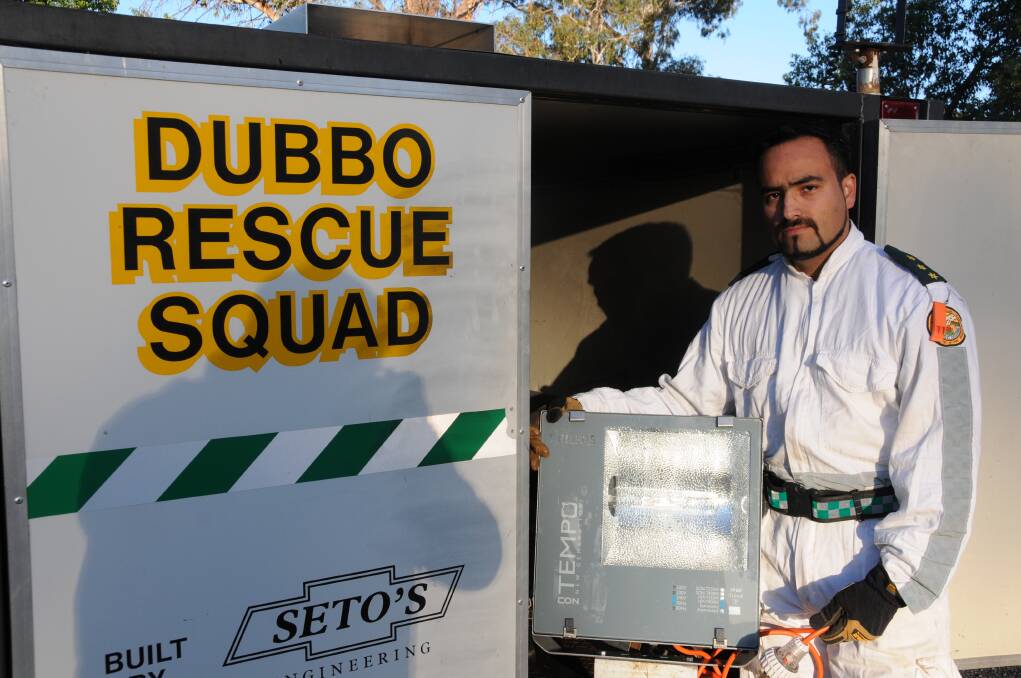 Dubbo Rescue Squad deputy captain Luis Perez-Mora with a light similar to the ones stolen on the weekend. Photo: BEN WALKER