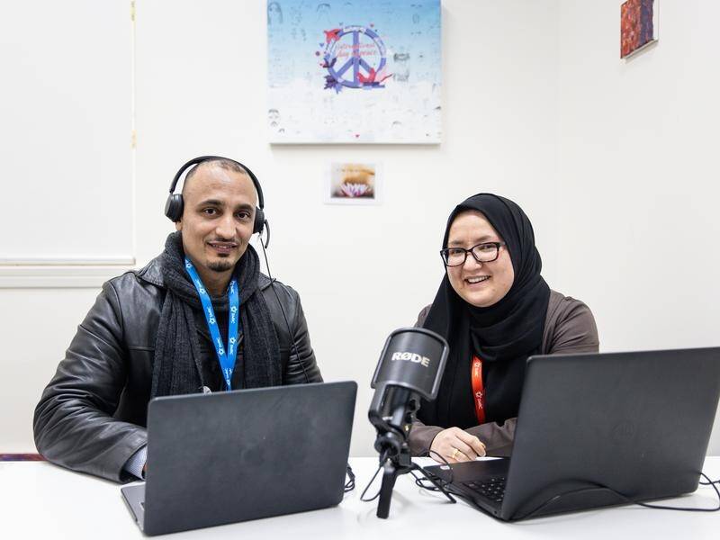 Afghan refugees Mirwais Janbaz and Najma Ahmadi have engaged in a podcast in the Dari language. (Diego Fedele/AAP PHOTOS)