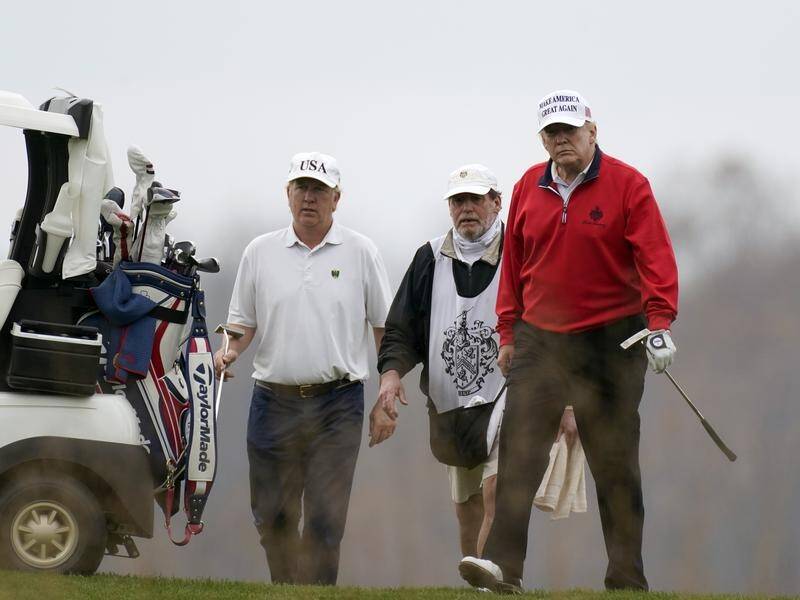 US President Donald Trump has again spent the day golfing as another election lawsuit is dismissed.
