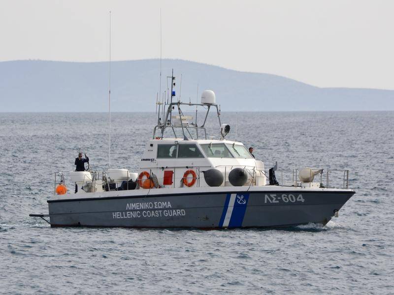 Greek Coast Guard vessels are searching for migrants missing after a boat capsized. (AP PHOTO)