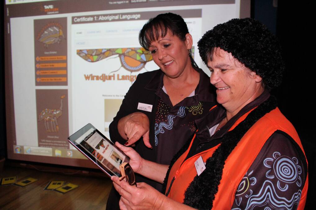TAFE Western Yarradamarra Centre head teacher Connie Ah See and fellow teacher Elizabeth Wright, known as Aunty Beth, confer after the launch of the new national and online course based on the Wiradjuri language.  
Photo: Contributed
